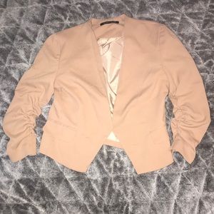 Tan blazer jacket.